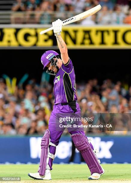 Arcy Short of the Hurricanes celebrates after scoring a century during the Big Bash League match between the Brisbane Heat and the Hobart Hurricanes...