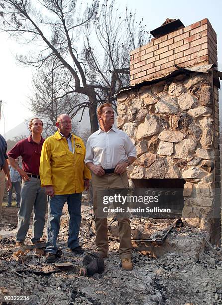 Rep. Adam Schiff , Acting Secretary of Cal E.M.A. Matt Bettenhausen and California Gov. Arnold Schwarzenegger tour homes that were burned by the...