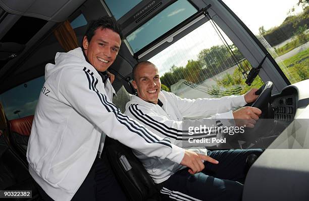 National player Piotr Trochowski and goalkeeper Robert Enke pose in the team bus during a safety training at the ADAC center on September 3, 2009 in...