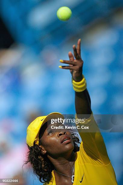 Serena Williams serves during Day 4 of the Western & Southern Financial Group Women's Open on August 13, 2009 at the Lindner Family Tennis Center in...