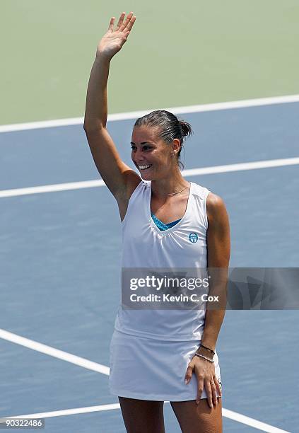 Flavia Pennetta of Italy celebrates her win over Venus Williams during Day 4 of the Western & Southern Financial Group Women's Open on August 13,...