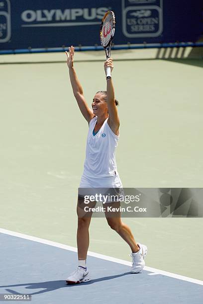 Flavia Pennetta of Italy celebrates her win over Venus Williams during Day 4 of the Western & Southern Financial Group Women's Open on August 13,...