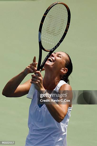 Flavia Pennetta of Italy reacts to her win over Venus Williams during Day 4 of the Western & Southern Financial Group Women's Open on August 13, 2009...