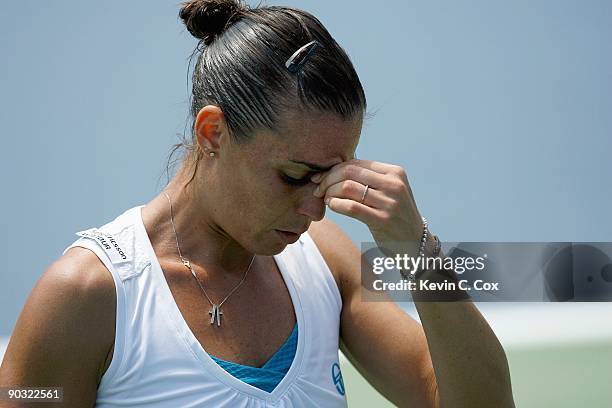 Flavia Pennetta of Italy reacts to her play against Venus Williams during Day 4 of the Western & Southern Financial Group Women's Open on August 13,...