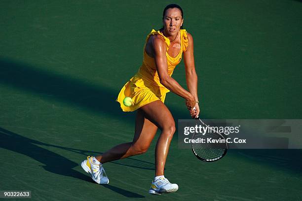 Jelena Jankovic of Serbia returns a shot to Victoria Azarenka of Belarus during Day 4 of the Western & Southern Financial Group Women's Open on...
