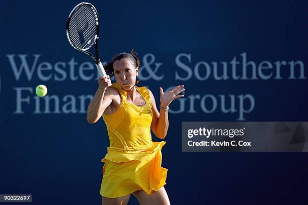 Jelena Jankovic of Serbia returns a shot to Victoria Azarenka of Belarus during Day 4 of the Western & Southern Financial Group Women's Open on...