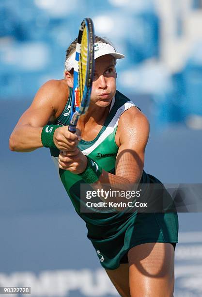 Sybille Bammer of Austria returns the ball to Serena Williams during Day 4 of the Western & Southern Financial Group Women's Open on August 13, 2009...