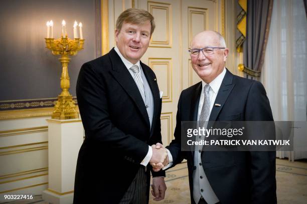 Ambassador to The Netherlands, Peter Hoekstra , shakes hands with Dutch King Willem-Alexander after presenting his credentials during a ceremony at...
