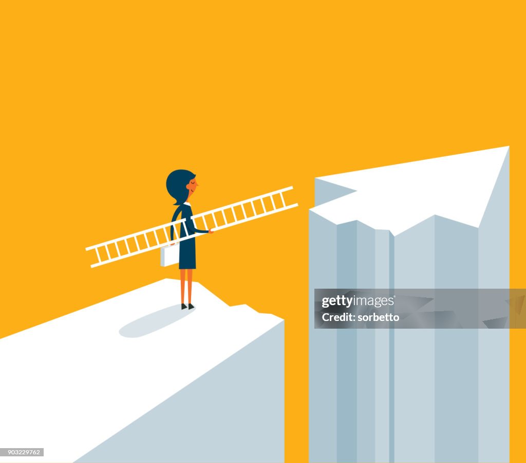 Businesswoman on standing between chasm and success