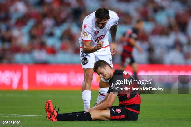 Ersan Gulum of Adelaide gestures to Oriol Riera of the Wanderers during the round 15 A-League match between the Western Sydney Wanderers and Adelaide...