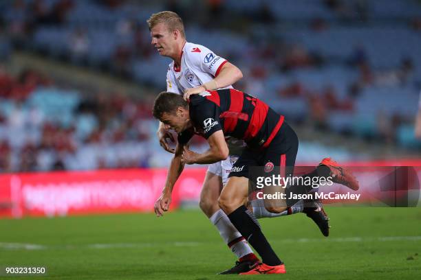 Oriol Riera of the Wanderers is challenged by Ryan Kitto of Adelaide during the round 15 A-League match between the Western Sydney Wanderers and...