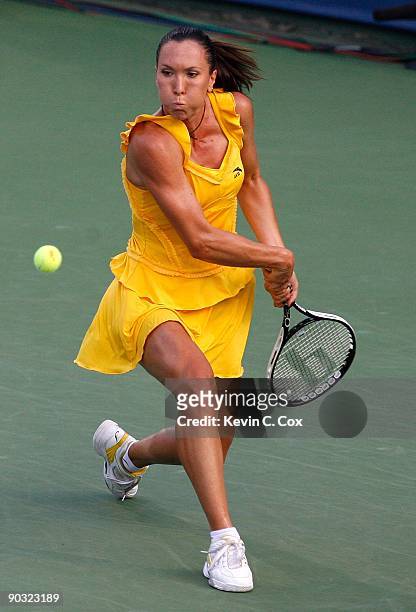 Jelena Jankovic of Serbia returns a shot to Elena Dementieva of Russia during the semifinals of the Western & Southern Financial Group Women's Open...