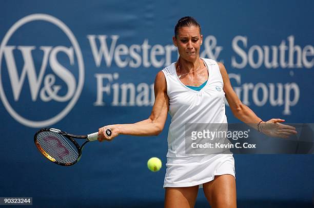 Flavia Pennetta of Italy returns a shot to Dinara Safina of Russia in the semifinals of the Western & Southern Financial Group Women's Open on August...