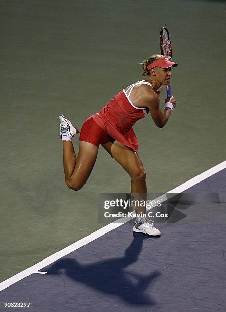 Elena Dementieva of Russia serves to Jelena Jankovic of Serbia during the semifinals of the Western & Southern Financial Group Women's Open on August...