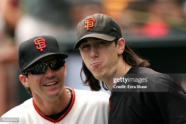 Tim Lincecum and Barry Zito of the San Francisco Giants stands in the dugout before their game against the Colorado Rockies at AT&T Park on August...