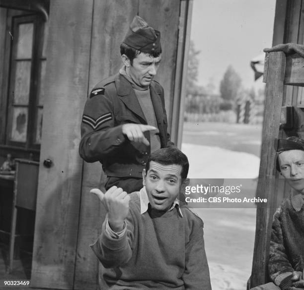 Richard Dawson as Cpl. Peter Newkirk, standing, and Robert Clary as Cpl. Louis LeBeau in ?The 43rd A Moving Story?, an episode from the CBS...