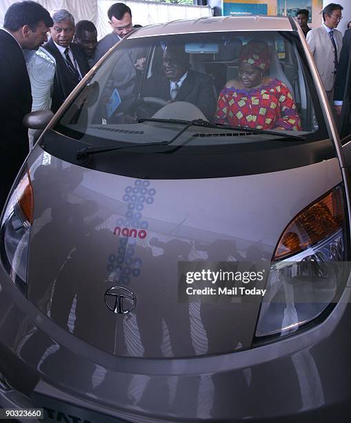 Namibian President Hifikepunye Pohamba and first lady Penehupifo Pohamba sit inside a top end version of the world's cheapest car the Tata Nano...