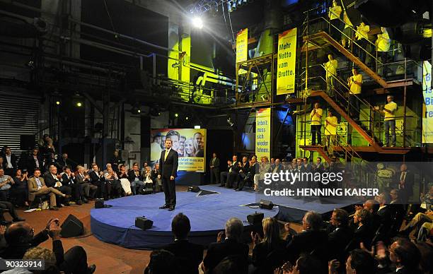 The chairman of the German Free Democrats party Guido Westerwelle cheers during the launch of the federal electoral campaign of their party on...