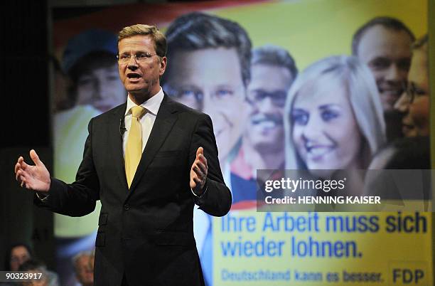 The chairman of the German Free Democrats party Guido Westerwelle delivers a speech during the launch of the federal electoral campaign of their...