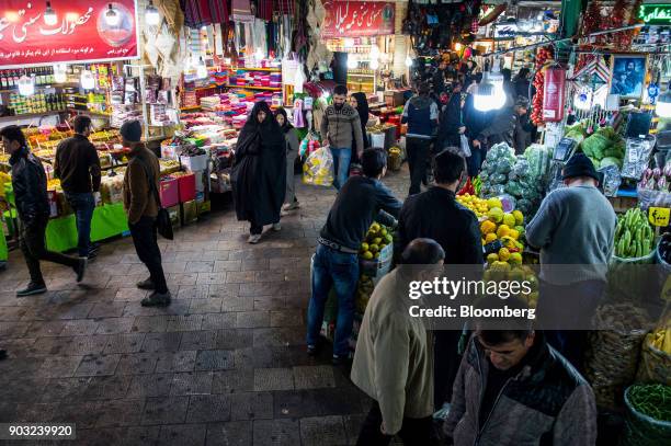 Shoppers browse stores selling food, electronics, clothing and jewelry in the Tajrish market bazaar in Tehran, Iran, on Sunday, Jan. 7, 2018. A wave...