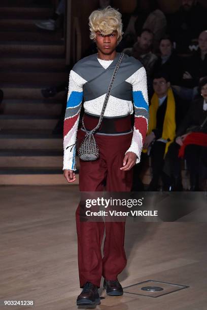 Model walks the runway at the Kiko Kostadinov Fall/Winter 2018/2019 show during London Fashion Week Men's January 2018 at Old Selfridges Hotel on...