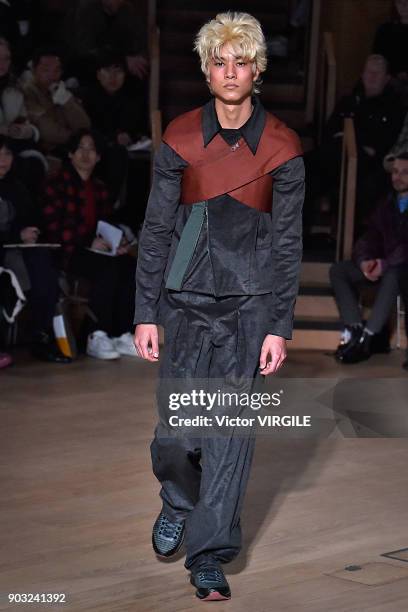 Model walks the runway at the Kiko Kostadinov Fall/Winter 2018/2019 show during London Fashion Week Men's January 2018 at Old Selfridges Hotel on...