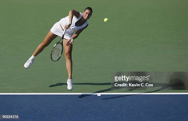 Flavia Pennetta of Italy serves during Day 5 of the Western & Southern Financial Group Women's Open on August 14, 2009 at the Lindner Family Tennis...