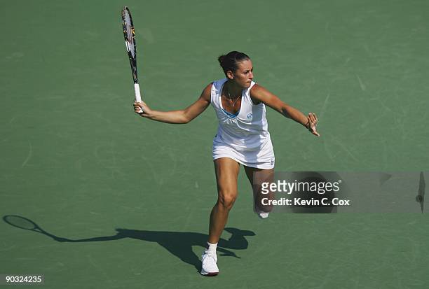 Flavia Pennetta of Italy returns a shot during Day 5 of the Western & Southern Financial Group Women's Open on August 14, 2009 at the Lindner Family...