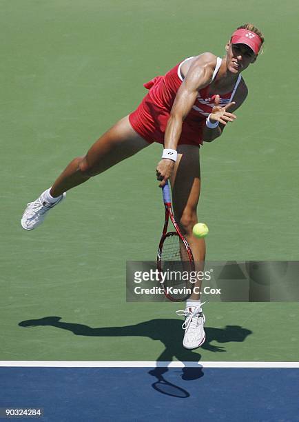 Elena Dementieva of Russia serves during Day 5 of the Western & Southern Financial Group Women's Open on August 14, 2009 at the Lindner Family Tennis...