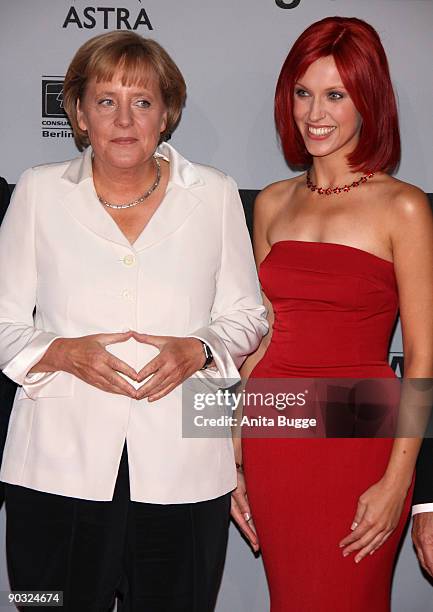 German Chancellor Angela Merkel and 'Miss IFA' attend the IFA Opening Gala at the Palais am Funkturm on September 3, 2009 in Berlin, Germany. The IFA...