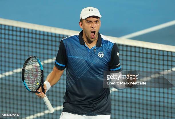 Gilles Muller of Luxembourg celebrates winning match point in his second round match against John Millman of Australia during day four of the 2018...