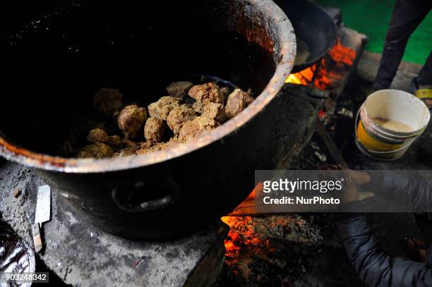 Raw Hard molasses boiling to prepare molasses Chaku at Tokha, Kathmandu, Nepal on Wednesday, January 10, 2018. Molasses Chaku is usually prepared and...
