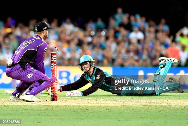 Brendan Doggett of the Heat makes his ground during the Big Bash League match between the Brisbane Heat and the Hobart Hurricanes at The Gabba on...