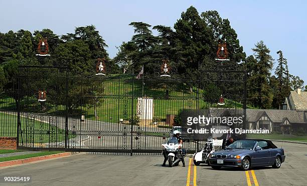 Glendale police officers guard the front entrance of the Forest Lawn Memorial Parks & Mortuaries on September 3, 2009 in Glendale, California....