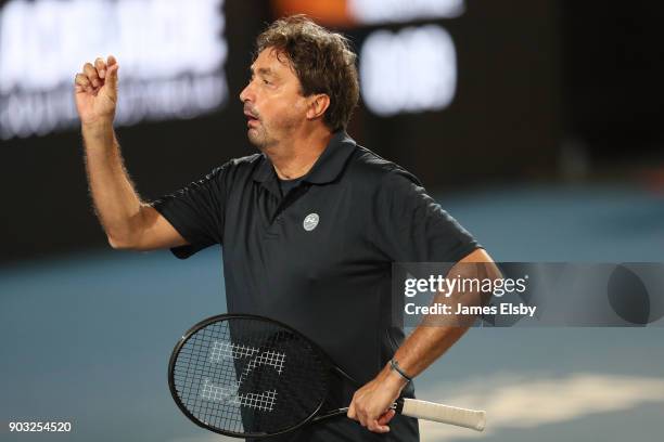 Henri Leconte of France competes in his match against Mark Philippoussis of Australia and Mansour Bahrami of Iranon day three of the 2018 World...