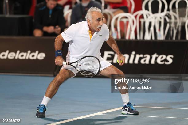 Mansour Bahrami of Iran competes in his match against Robby Ginepri of the USA and Henri Leconte of France on day three of the 2018 World Tennis...