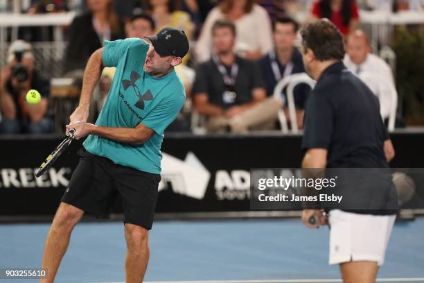 Robby Ginepri of the USA and Henri Leconte of France compete in their match against Mark Philippoussis of Australia and Mansour Bahrami of Iranon day...