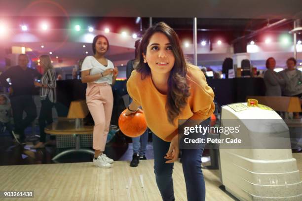 group of young women bowling - ten pin bowling foto e immagini stock