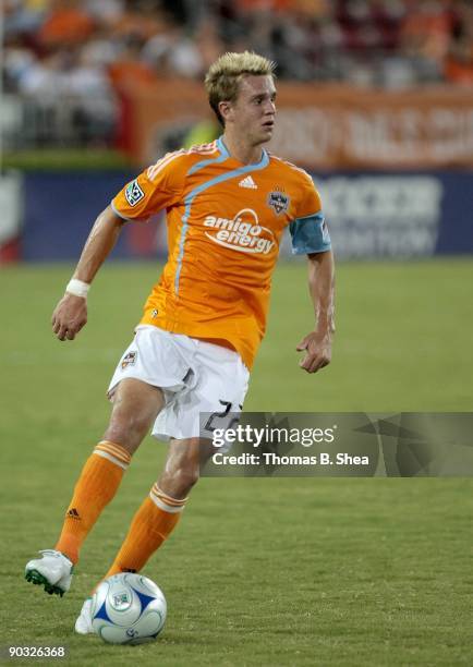 Stuart Holden of the Houston Dynamo dribbles the ball against the Seattle Sounders FC at Robertson Stadium on August 23, 2009 in Houston, Texas.