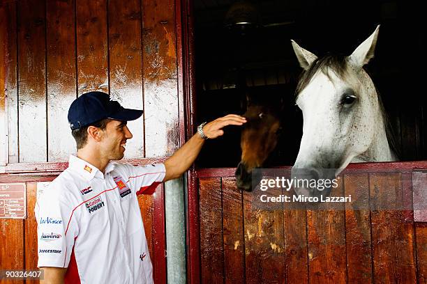 Alex De Angelis of Rep. San Marino and San Carlo Honda Gresini participates in a ''Visit to the San Marino Republic and the San Patrignano...