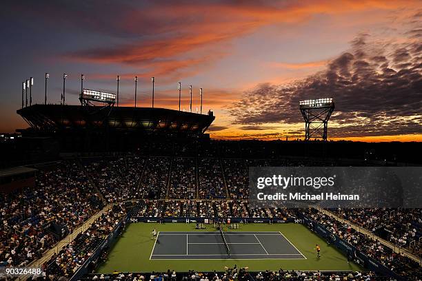 General view of the sunset over Arthur Ashe Stadium as Novak Djokovic of Serbia plays Carsten Ball of Australia in Louis Armstrong Stadium during day...