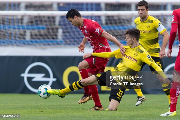 Hamdi Harbaoui and Julian Weigl of Dortmund battle for the ball during the Friendly match between Borussia Dortmund and SV Zulte Waregem at Estadio...