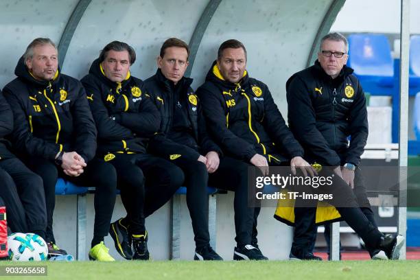 Goalkeeper coach Wolfgang de Beer of Dortmund, Sporting director Michael Zorc of Dortmund, Assistant coach Joerg Heinrich of Dortmund, Assistant...