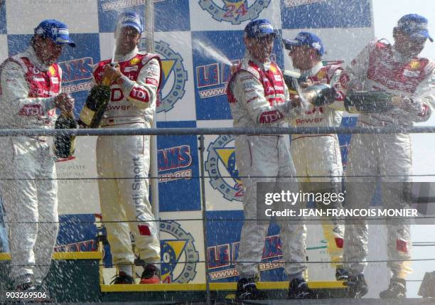 Audi R10 diesel drivers Germans Franck Biela and Marco Werner, Italian Rinaldo Capello, Briton Allan McNish and Danish Tom Kristensen celebrate on...