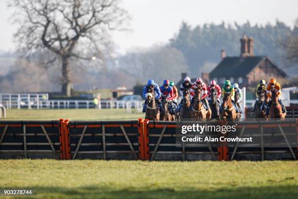 General view as runners race towards the hurdle in front of the grandstands at Ludlow racecourse on January 10, 2018 in Ludlow, England.