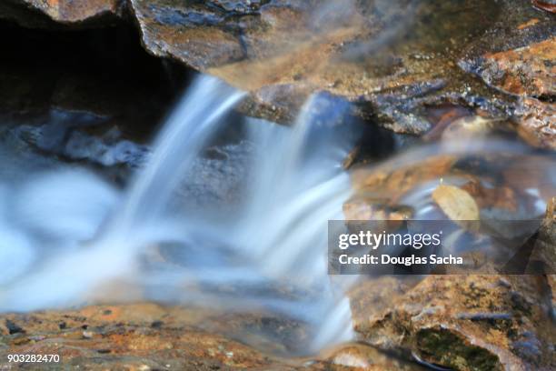 flowing mountain stream - groundwater stock pictures, royalty-free photos & images