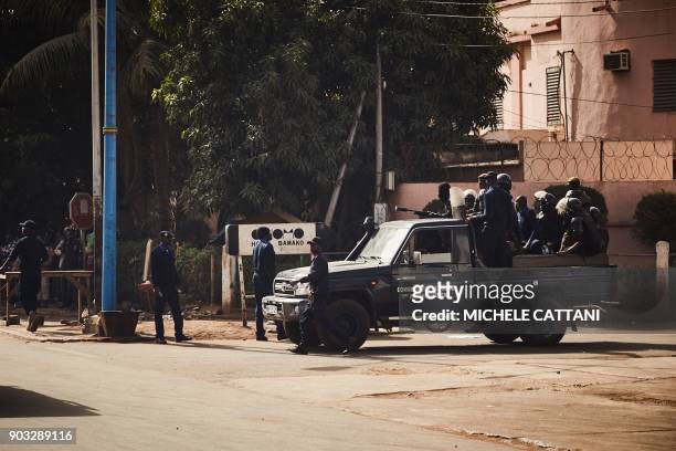 Malian police forces deploy to block a group of demonstrators marching towards the French Embassy in Bamako, to protest against the continued...
