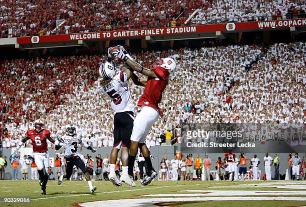 Stephon Gilmore of the South Carolina Gamecocks knocks down the ball against Jarvis Williams of the North Carolina State Wolfpack that seal a 7-3...