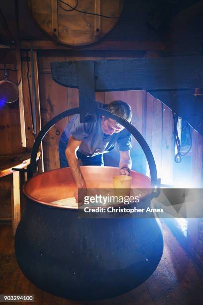traditional artisanal cheesemaking - traditional craftsman stock pictures, royalty-free photos & images