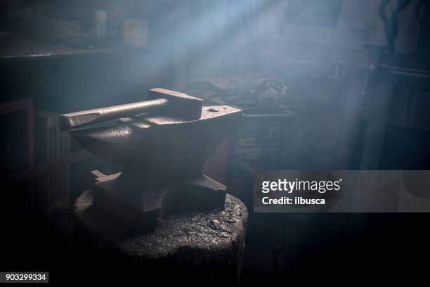 blacksmith artist smithy studio laboratory - metal hammer stock pictures, royalty-free photos & images